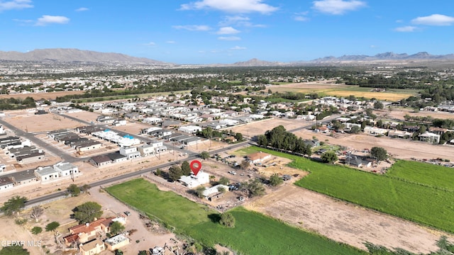 birds eye view of property with a mountain view