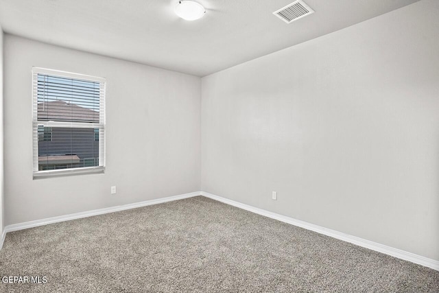 unfurnished room featuring carpet floors