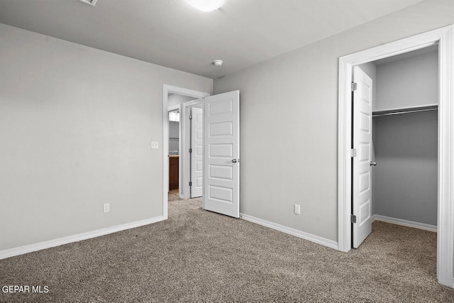 unfurnished bedroom with carpet floors and a closet