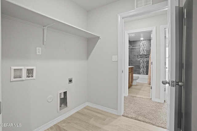 laundry room featuring hookup for a washing machine, electric dryer hookup, light carpet, and hookup for a gas dryer