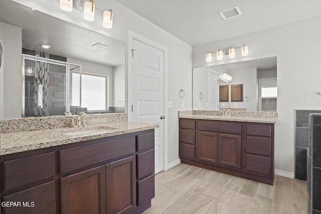 bathroom with vanity and walk in shower