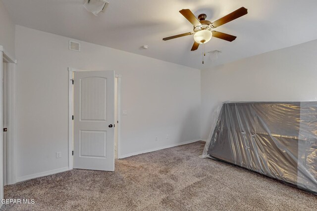 unfurnished bedroom with carpet and ceiling fan