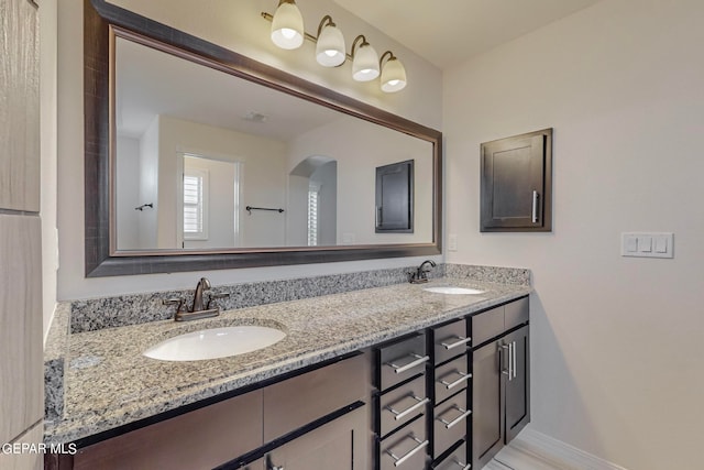 bathroom with dual bowl vanity