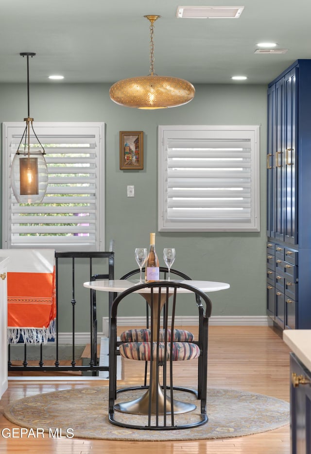 dining room with light hardwood / wood-style flooring