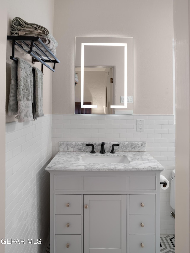 bathroom featuring toilet and vanity