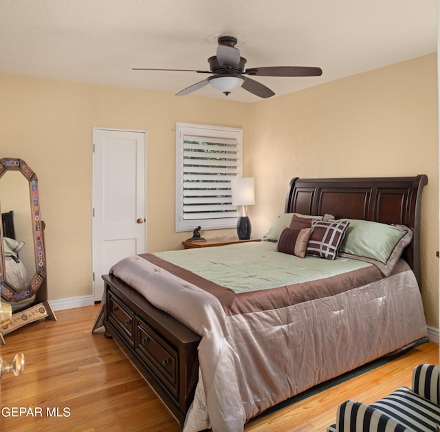 bedroom featuring light wood-type flooring and ceiling fan