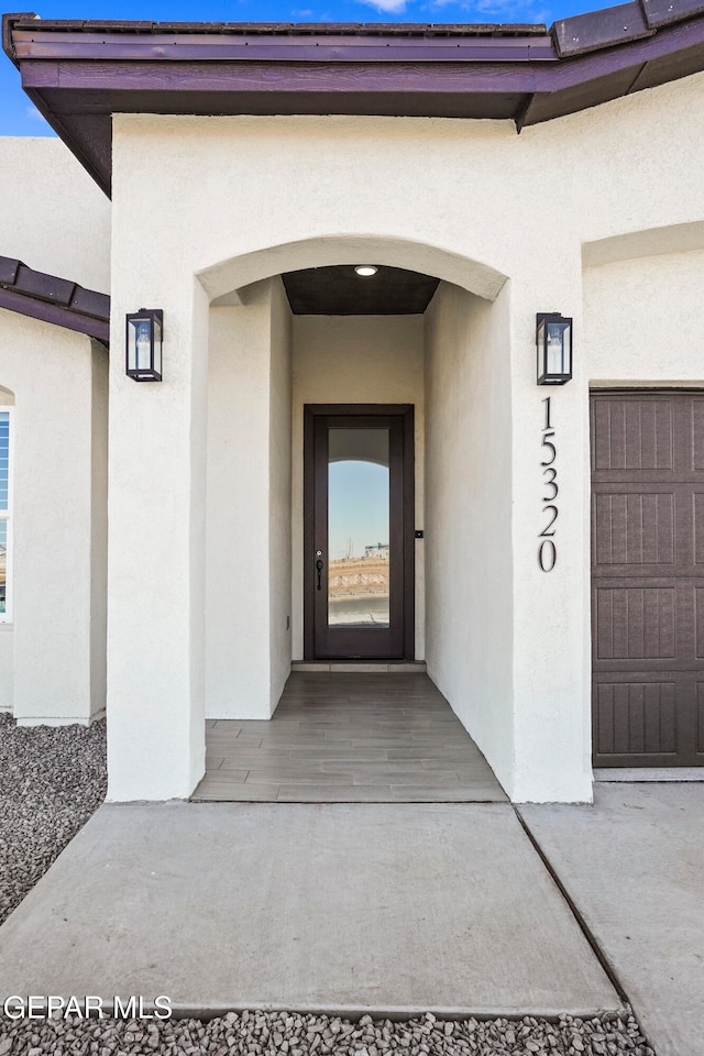 entrance to property featuring a garage