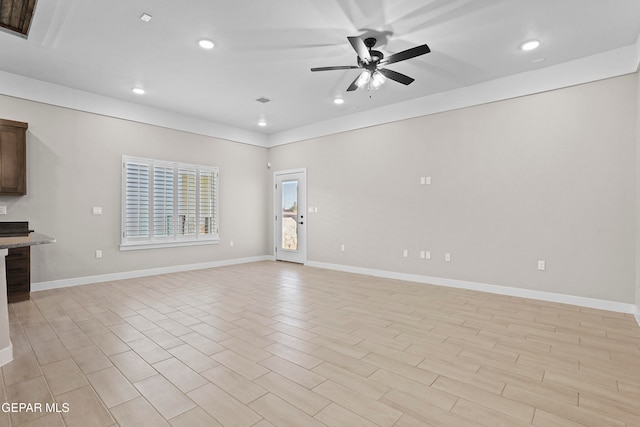 unfurnished living room featuring light wood-type flooring and ceiling fan