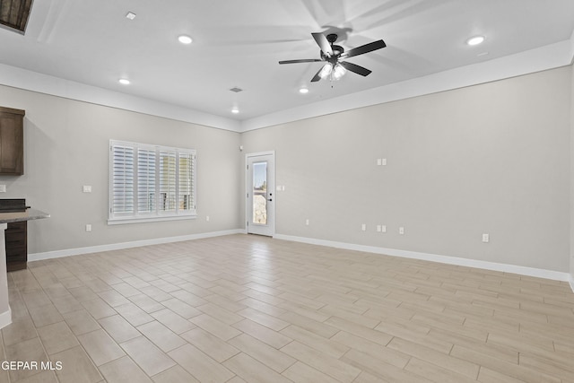 unfurnished living room featuring recessed lighting, baseboards, ceiling fan, and light wood finished floors