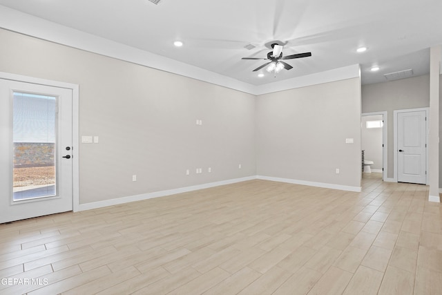 empty room with light hardwood / wood-style floors and ceiling fan