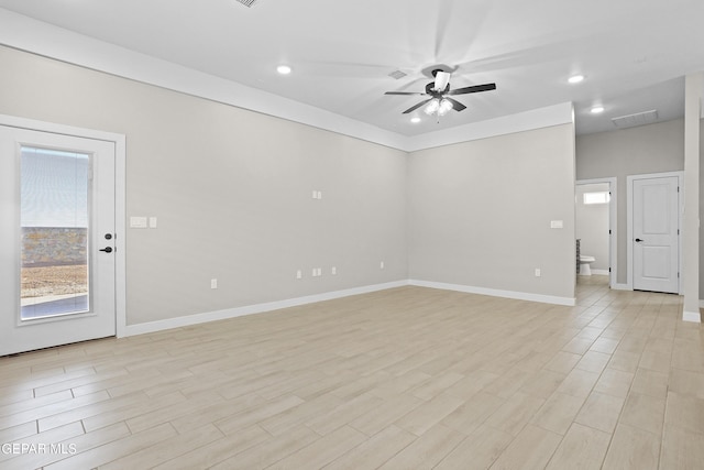 spare room featuring ceiling fan, visible vents, baseboards, light wood-style floors, and recessed lighting