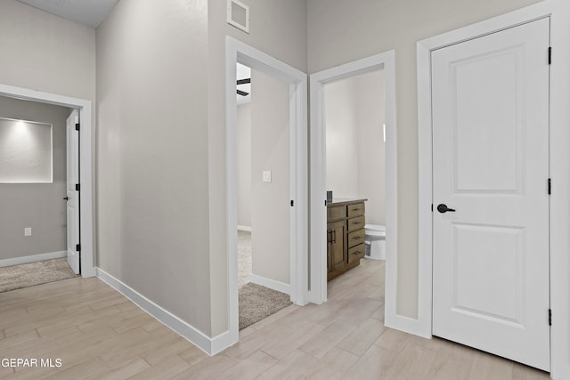 hallway with light wood-type flooring