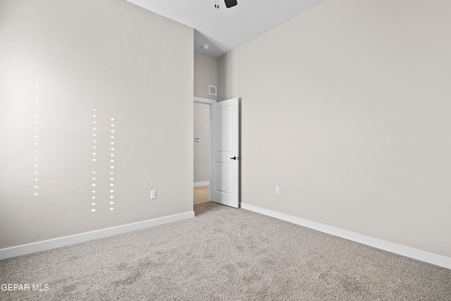 unfurnished bedroom featuring ceiling fan and light carpet