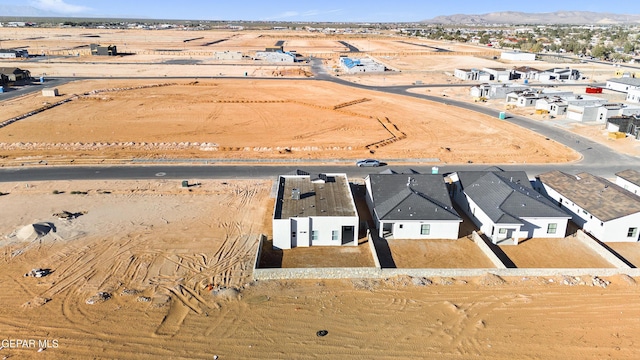 drone / aerial view featuring a mountain view and a residential view