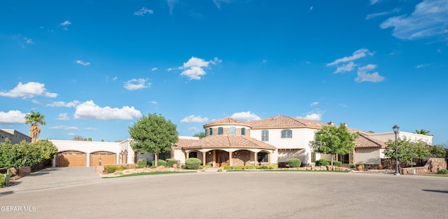 878 Cortona Pl, El Paso, TX 79928 - mediterranean / spanish house featuring a garage