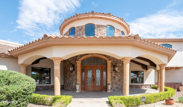 entrance to property featuring french doors