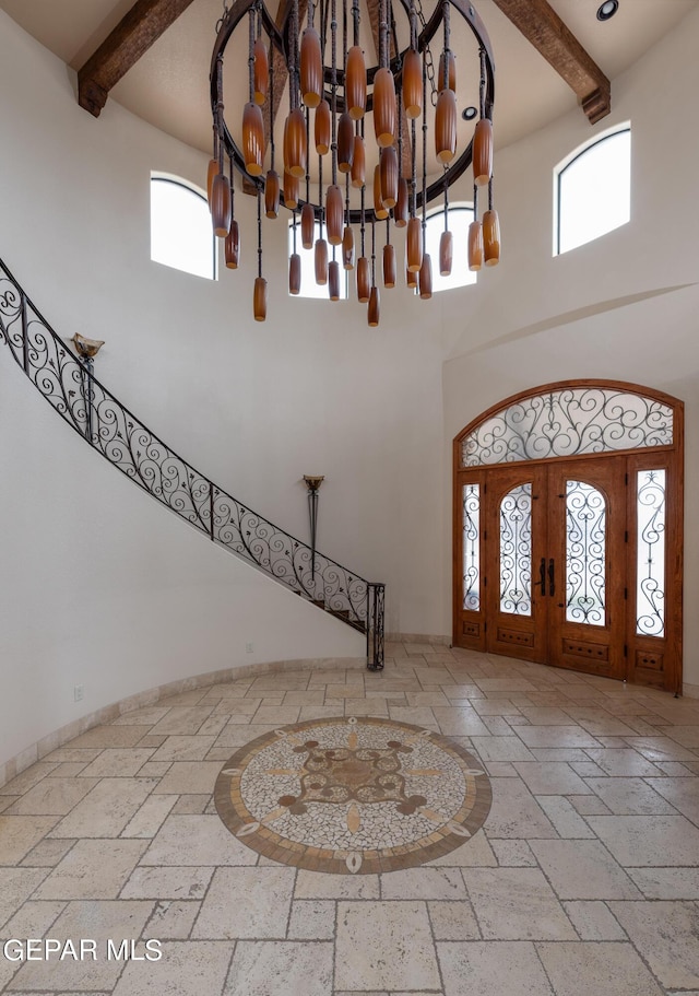 878 Cortona Pl, El Paso, TX 79928 - entrance foyer with an inviting chandelier, a wealth of natural light, french doors, and a high ceiling