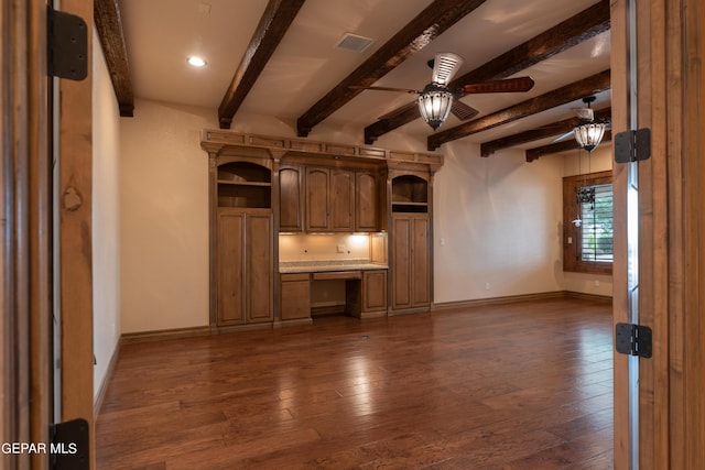 878 Cortona Pl, El Paso, TX 79928 - unfurnished living room featuring beamed ceiling, ceiling fan, dark hardwood / wood-style flooring, and built in desk