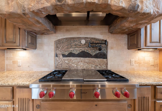 878 Cortona Pl, El Paso, TX 79928 - kitchen with tasteful backsplash, light stone counters, and stainless steel gas stovetop