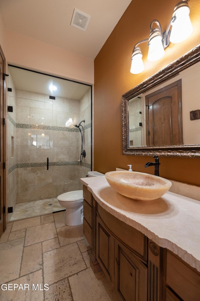 878 Cortona Pl, El Paso, TX 79928 - bathroom featuring vanity, toilet, and walk in shower