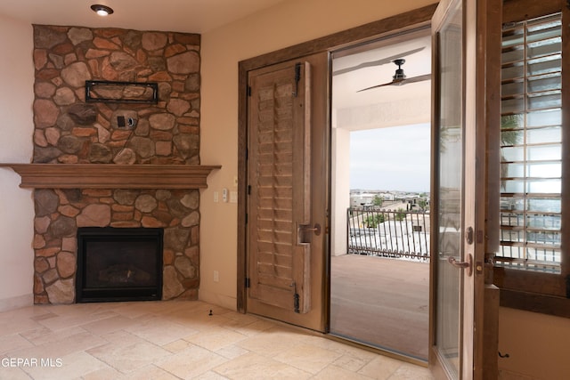 878 Cortona Pl, El Paso, TX 79928 - unfurnished living room featuring ceiling fan and a fireplace