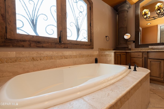 878 Cortona Pl, El Paso, TX 79928 - bathroom with ornate columns, vanity, and tiled tub
