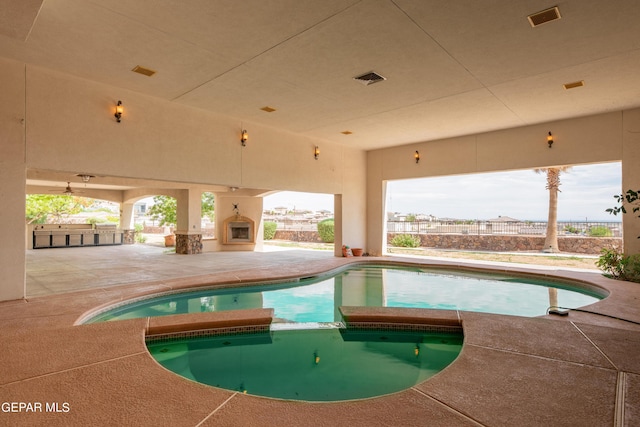 878 Cortona Pl, El Paso, TX 79928 - view of swimming pool with exterior fireplace and a patio area