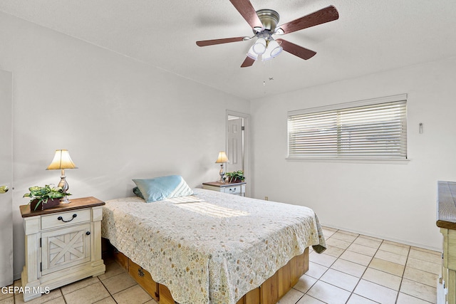 tiled bedroom with ceiling fan