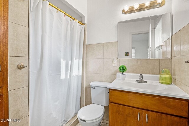 bathroom featuring vanity, tile walls, toilet, tile patterned flooring, and backsplash