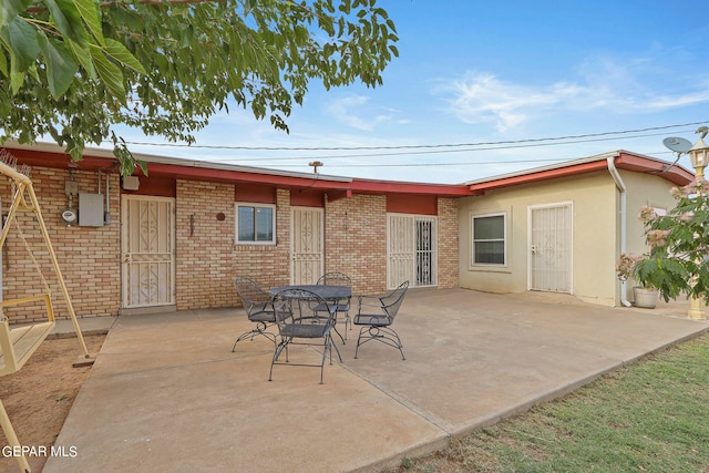 back of house featuring a patio area