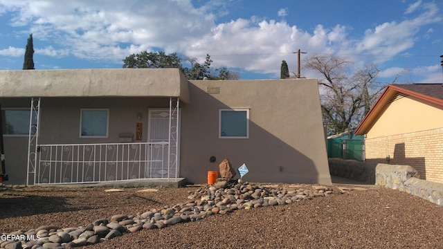 view of side of home with stucco siding