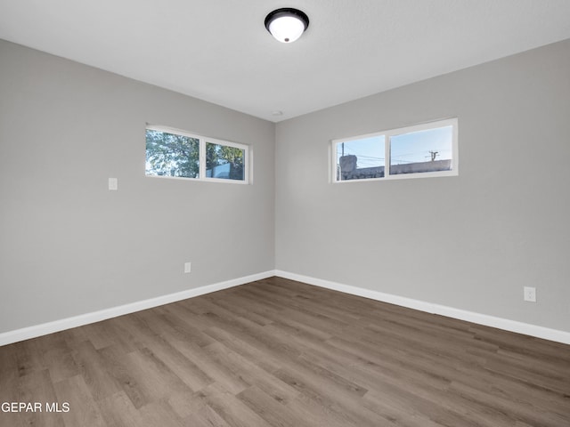 unfurnished room featuring hardwood / wood-style floors