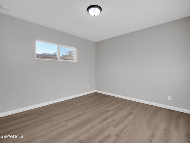 spare room with light hardwood / wood-style flooring