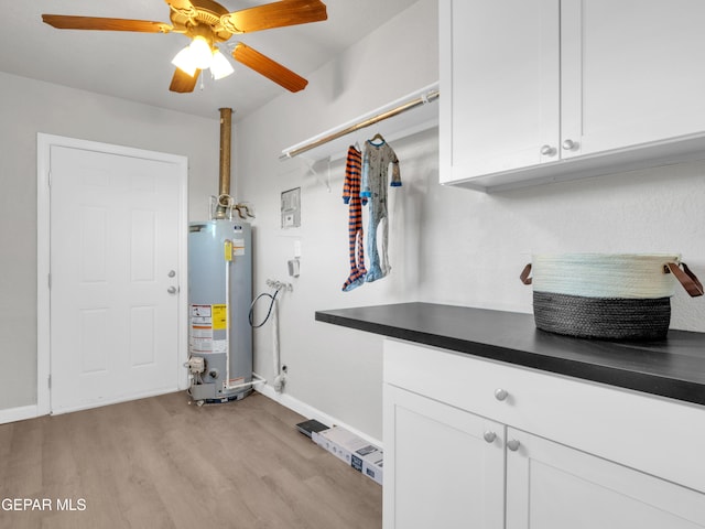 utility room with gas water heater