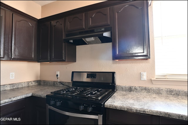 kitchen with dark brown cabinetry and stainless steel range with gas cooktop