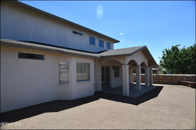 back of property with a patio area