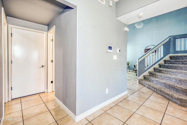 corridor with light tile patterned floors