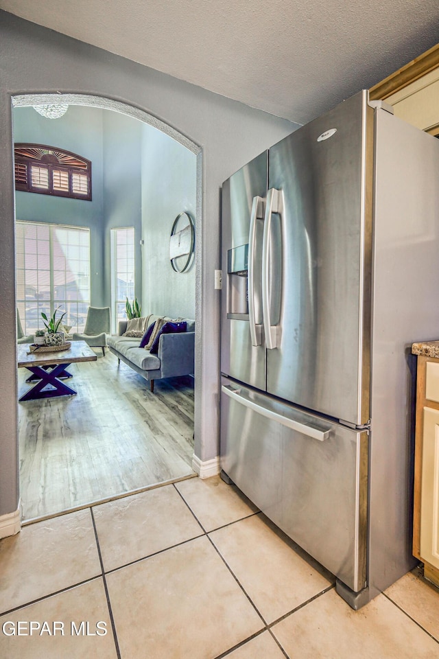 bathroom with tile patterned flooring and a textured ceiling