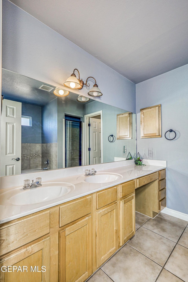 bathroom with vanity and tile patterned floors