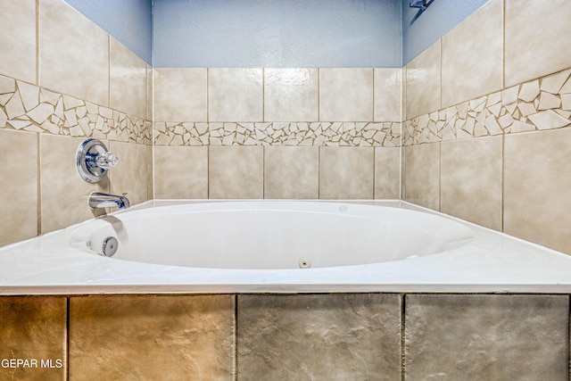 bathroom featuring tiled tub