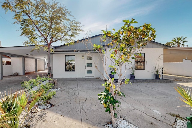 exterior space with a carport