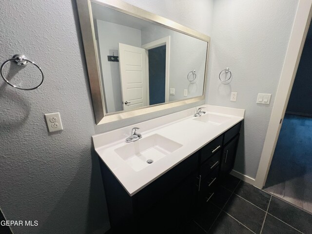 bathroom featuring double vanity and tile patterned floors