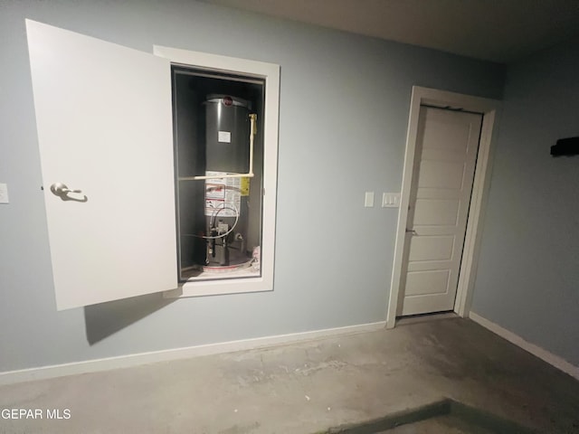 interior space featuring heating unit and concrete floors