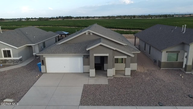 view of front of home featuring a rural view and a garage