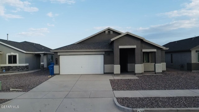 single story home featuring a garage