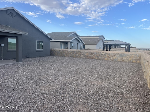 view of yard with a gazebo and a patio area