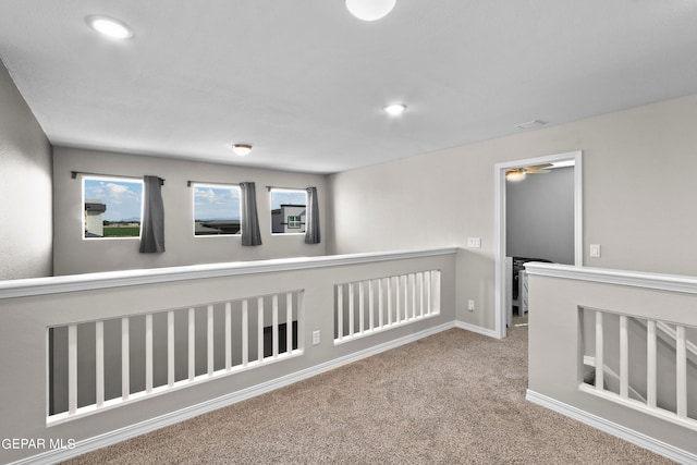 hallway featuring carpet floors