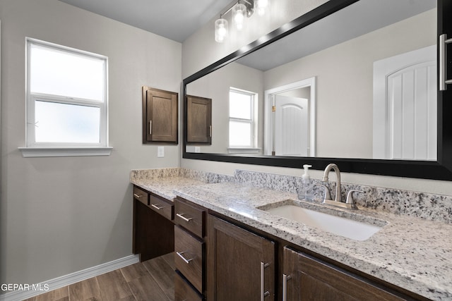 bathroom featuring vanity and wood-type flooring