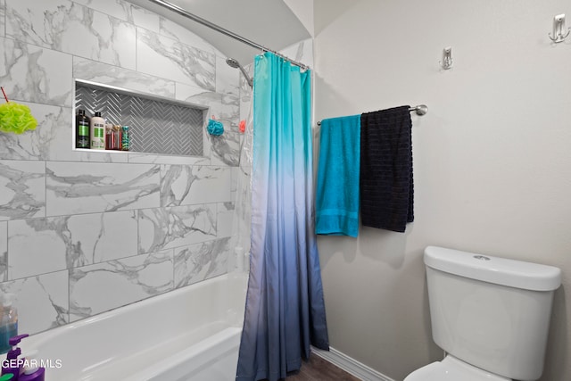 bathroom featuring toilet and shower / tub combo with curtain