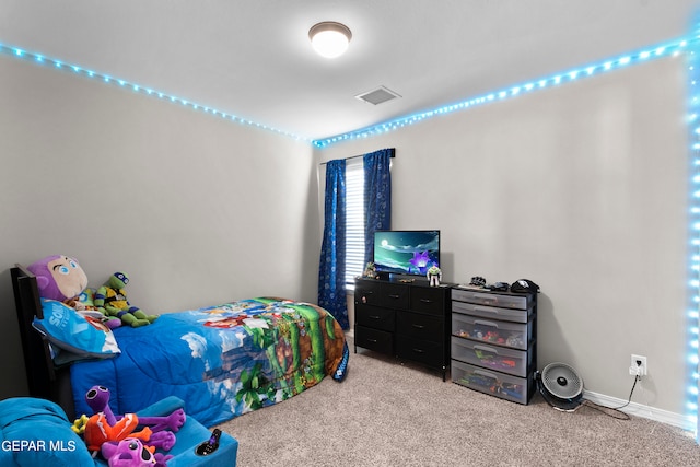 bedroom featuring light carpet